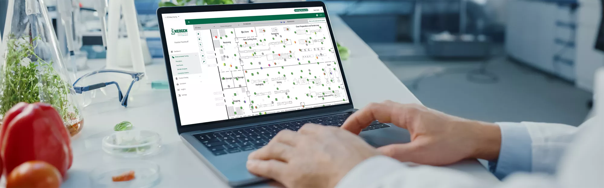 Lab technician using Neogen Analytics software on a laptop to digitize food safety